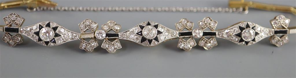 A 1920s gold and platinum, diamond and black onyx set bracelet, approx. 16cm,